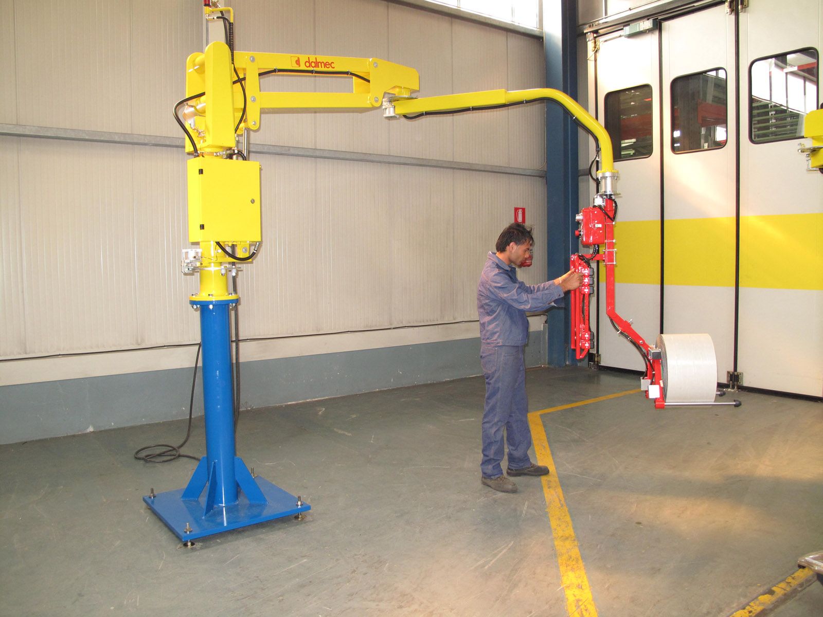 Dalmec UK Industrial Manipulator fitted with forks type tooling for handling reels